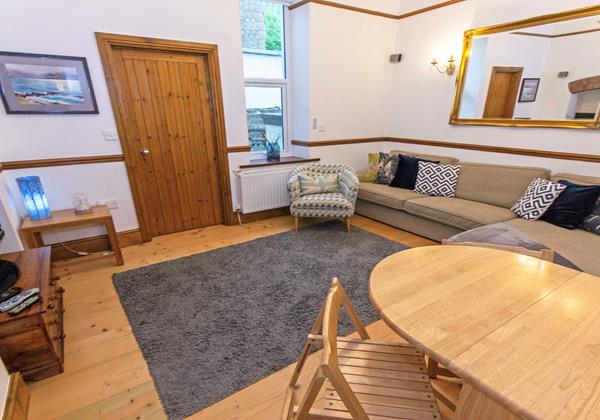 Lounge and dining area at Holiday home in croyde