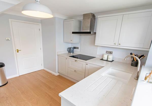 Oceanside kitchen with hob, oven, fridge freezer, dishwasher, washer dryer, toaster and kettle