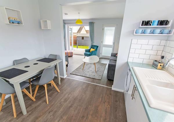 Open plan living with patio doors to the terrace