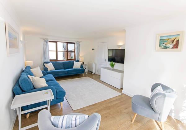 Airy and bright lounge with patio doors to terrace
