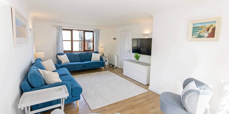 Airy and bright lounge with patio doors to terrace