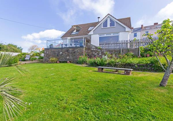 Large lawned garden with countryside views