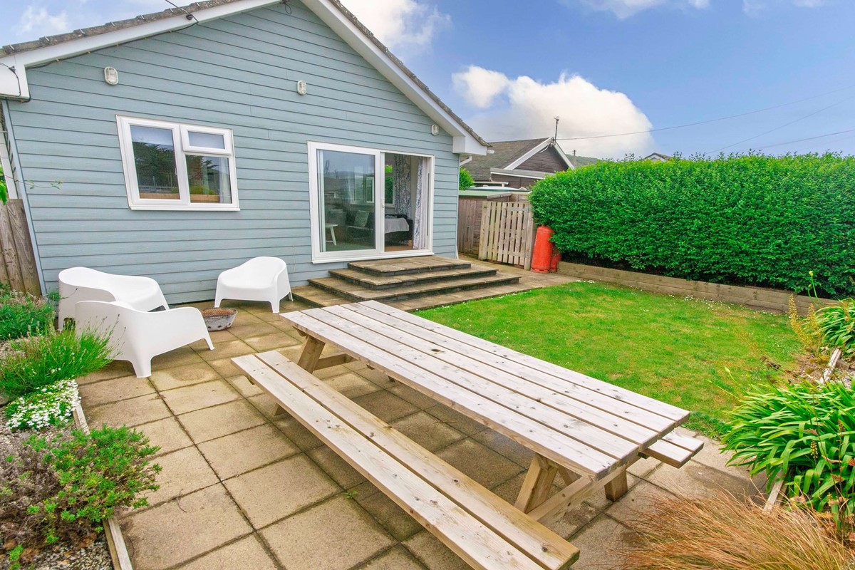 Rear Garden with patio furniture