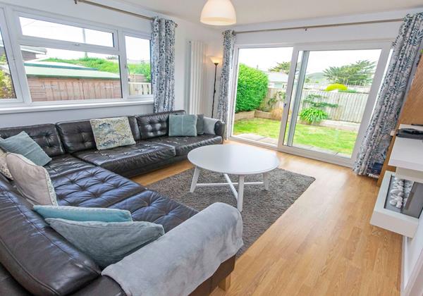 Lounge with patio doors leading to the garden