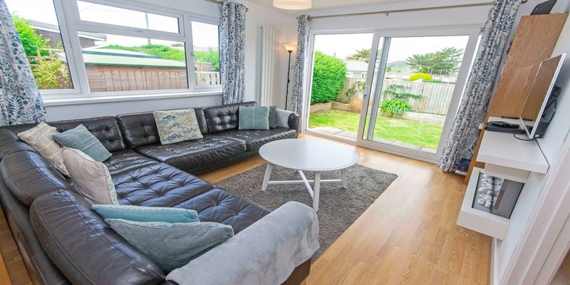 Lounge with patio doors leading to the garden