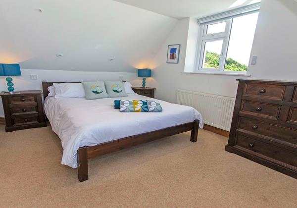 Kingsize bed with views out to Hartland and Croyde Bay North Devon