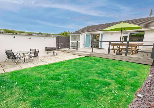 Enclosed garden laid to lawn