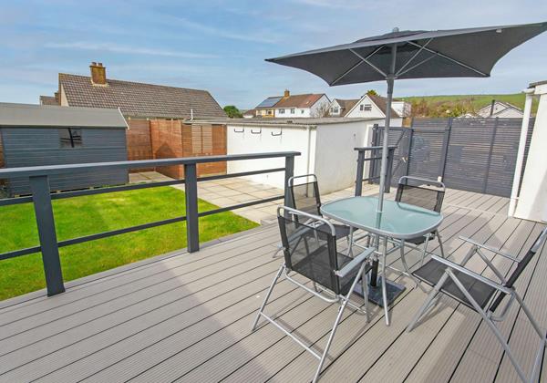 Beach style decking BBQ seating area