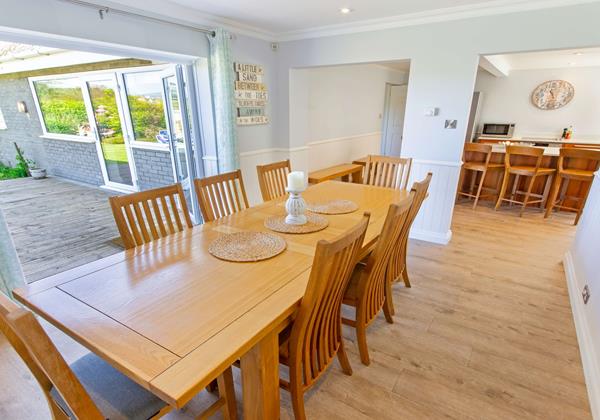 Large dining table open plan kitchen