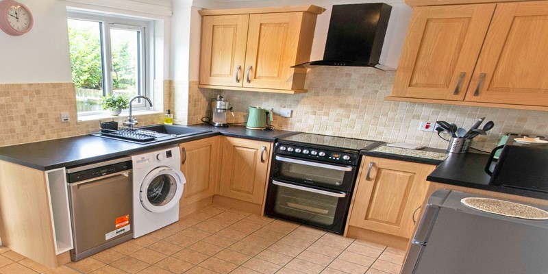 Spacious kitchen with coffee maker