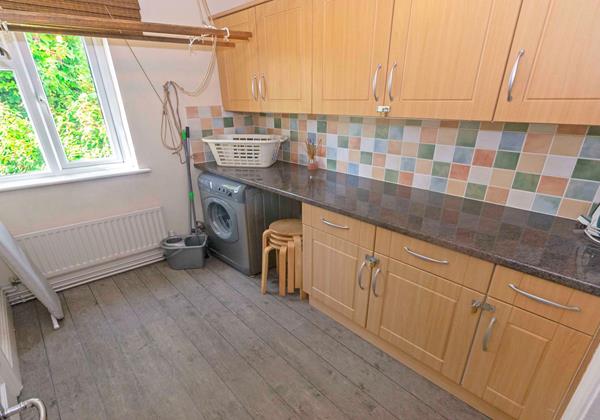 Utility room with washing machine
