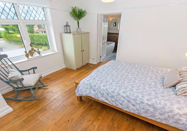 Cheerfully decorated master bedroom with en suite