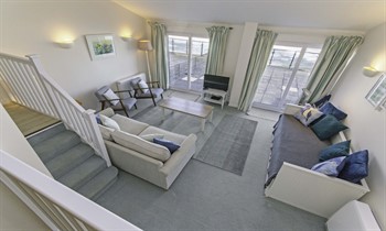 Lounge patio doors to balcony and sea views