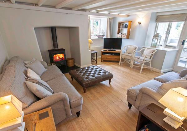 Cozy wood burner with comfortable sofas