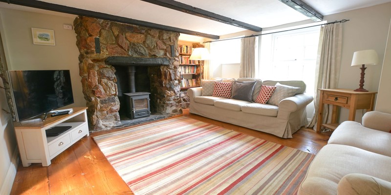 Cozy lounge with beamed cottage charm